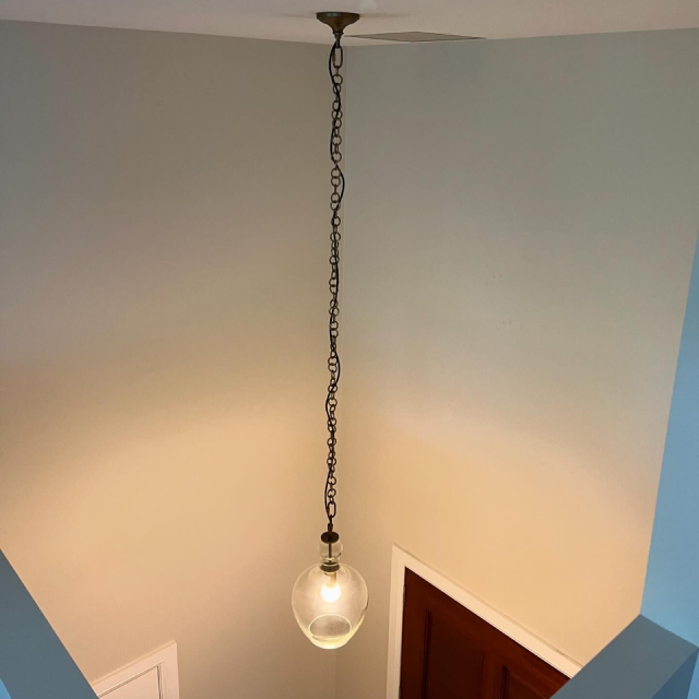 a chain light installed on a high ceiling